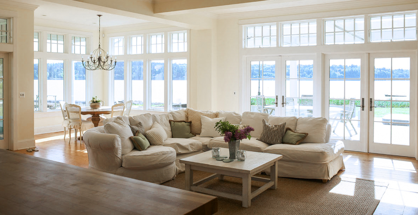 West Beach Traditional living room windows and water view